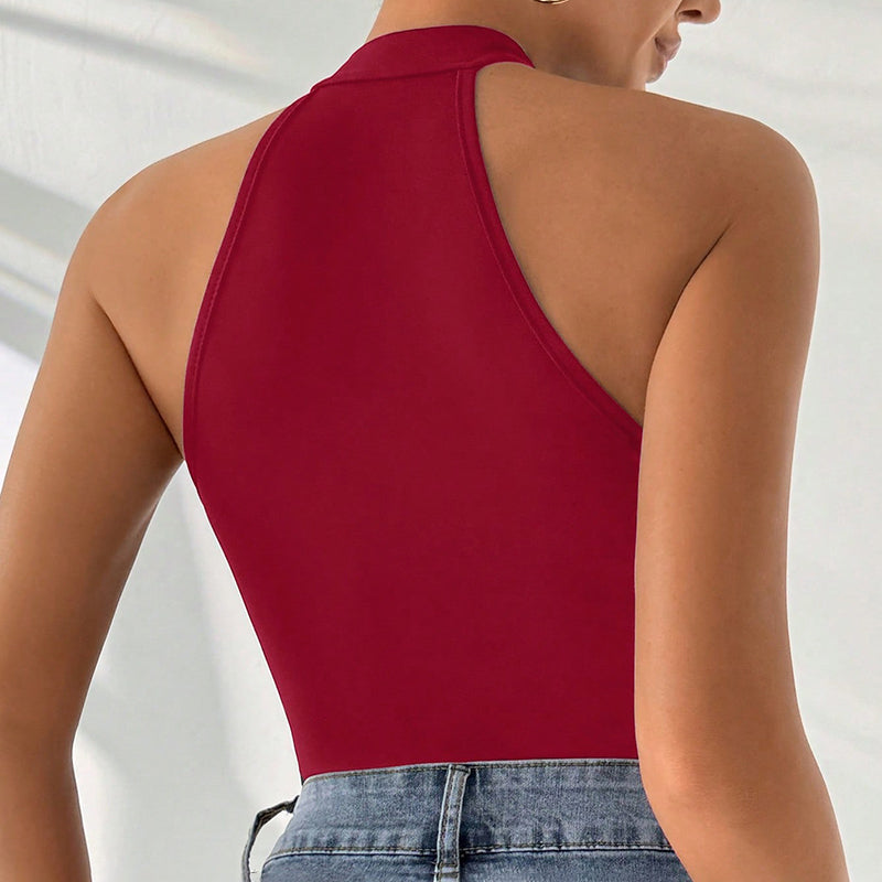 Red halter top worn by a person on a plain background
