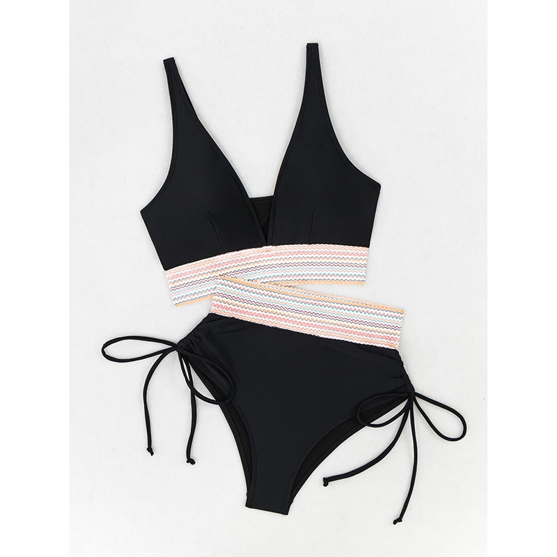 Black bikini set with striped waistband on a white background