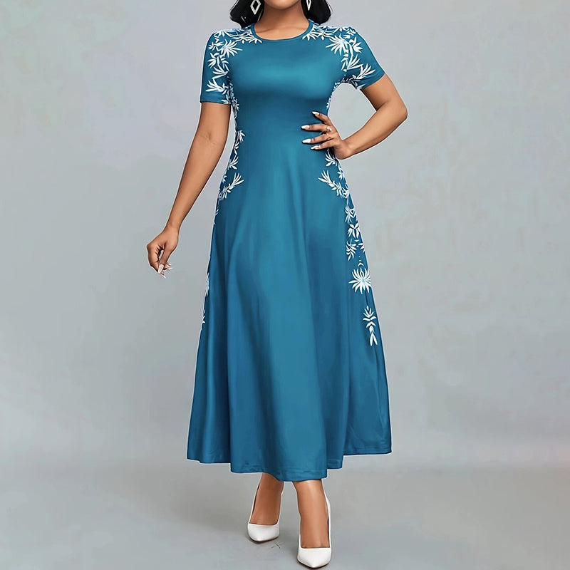 Teal dress with white floral patterns on a gray background