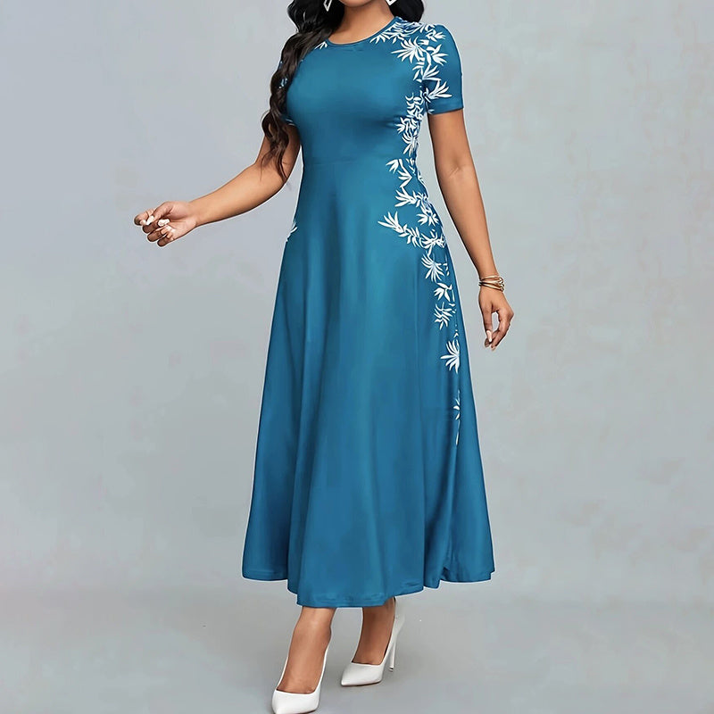 Blue dress with white floral embroidery on a gray background