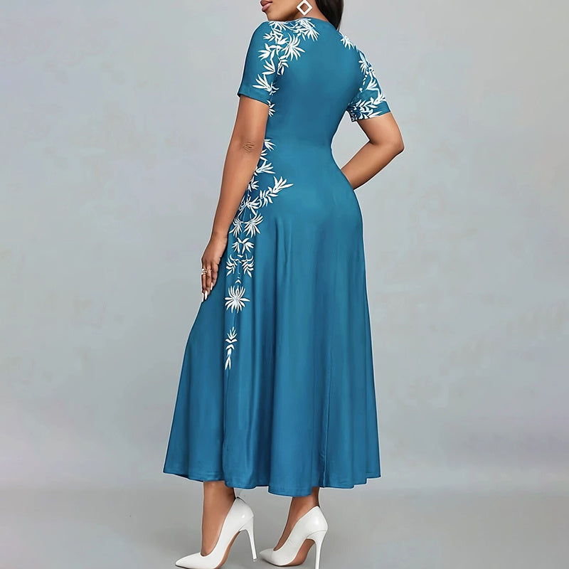 Blue dress with white floral patterns on a gray background