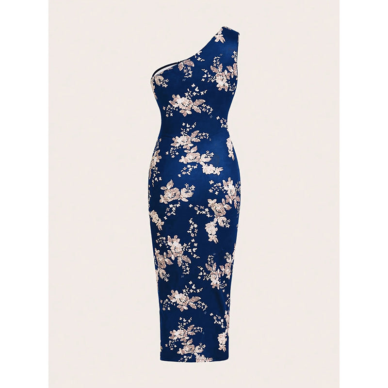 Navy blue one-shoulder dress with floral pattern on a light pink background