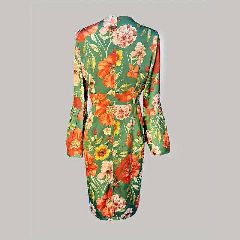 Floral dress with orange and pink flowers on a green background